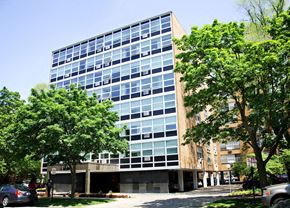 Evanston apartment for rent - a tall building with trees in front of it