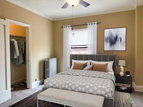 Chicago apartment for rent - a bedroom with a bed and a closet