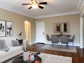 Chicago apartment for rent - a living room with a dining room table and a ceiling fan