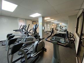 Chicago apartment for rent - A gym with treadmills and elliptical machines.