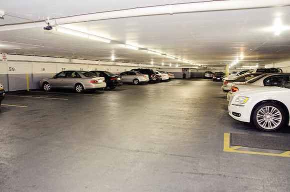 Chicago apartment for rent - a parking garage filled with lots of cars