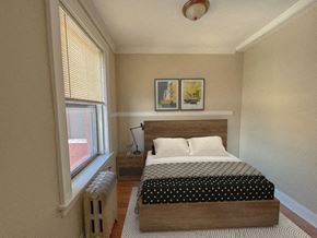 Chicago apartment for rent - a bedroom with a bed and a window