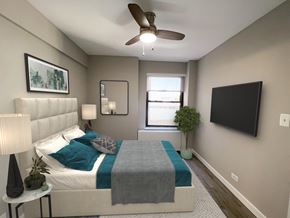Chicago apartment for rent - a bedroom with a bed and a ceiling fan