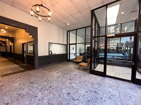 Chicago apartment for rent - an empty lobby with a pool in the corner of a building
