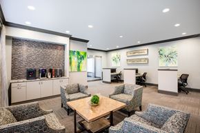 Kansas City apartment for rent - a lounge area with chairs and a coffee table