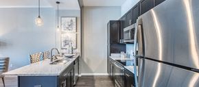 Kansas City apartment for rent - a kitchen with stainless steel appliances and a counter top