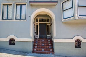 San Francisco apartment for rent - A building with a white door and steps leading up to it.