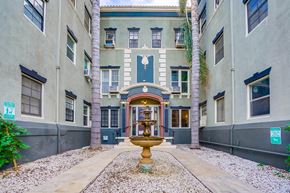 Los Angeles apartment for rent - a courtyard with a fountain in front of a building