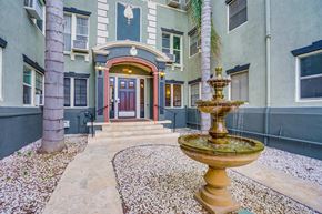 Los Angeles apartment for rent - a fountain in front of a house with a front door
