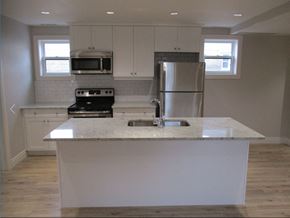 Waterloo apartment for rent - A kitchen with a white countertop and stainless steel appliances.