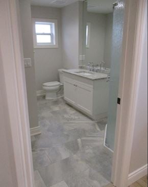 Waterloo apartment for rent - A bathroom with a toilet, sink, and a window.