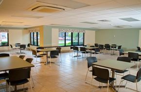 Rochester apartment for rent - a dining room with tables and chairs