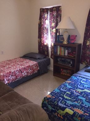 Rochester townhouse for rent - a bedroom with two beds and a couch