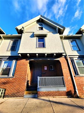 Rochester townhouse for rent - the front of a house with a blue sky in the background
