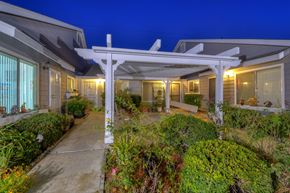 Midway City apartment for rent - the enclave at homecoming landing front yard at night