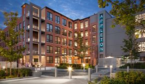 Lowell apartment for rent - The Appleton building is a multi-story brick building with a modern design.