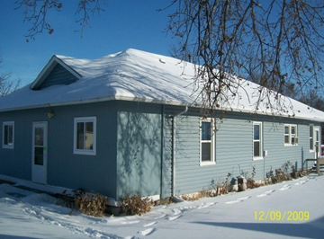 Bridgeport house for rent - a blue house with snow on top of it