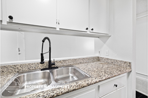 Los Angeles apartment for rent - A kitchen with a granite countertop and a stainless steel sink.