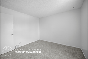 Los Angeles apartment for rent - a bedroom with white walls and carpet and a white door