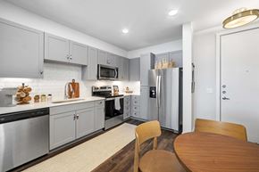 San Antonio apartment for rent - a kitchen with stainless steel appliances and a table and chairs