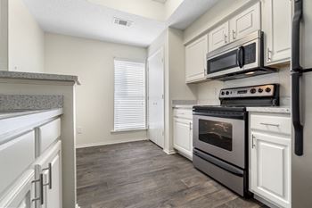 Contemporary upgrade apartment homes include: faux-granite countertops, stainless steel appliance package, brushed nickel lighting & hardware, upgraded faux-wood flooring & carpet and framed bathroom mirrors