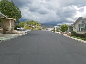 Highland apartment for rent - a city street with houses and mountains in the background