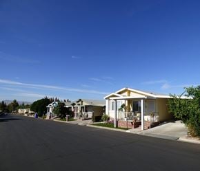 Highland apartment for rent - a row of houses on a street under a blue sky