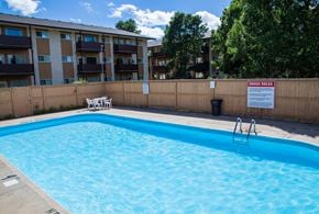 Brandon apartment for rent - an empty swimming pool in front of an apartment building