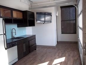 Lincoln apartment for rent - an empty room with a kitchen and a window