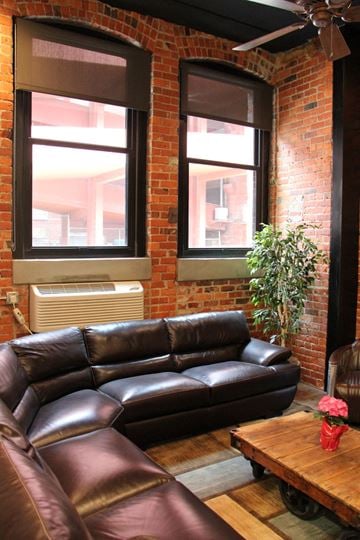 Lincoln apartment for rent - a living room with leather couches and a wooden table