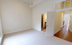 Philadelphia apartment for rent - A large empty room with a doorway leading to another room.
