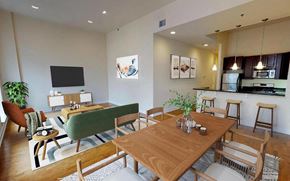 Philadelphia apartment for rent - A modern dining room with a wooden table and chairs.