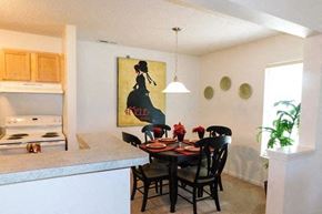 Grand Blanc apartment for rent - a kitchen and dining room with a table and chairs