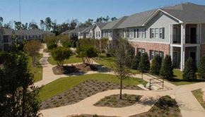 Biloxi apartment for rent - an aerial view of a neighborhood with houses and trees