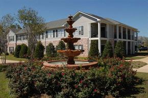 Biloxi apartment for rent - a fountain in a garden in front of a house