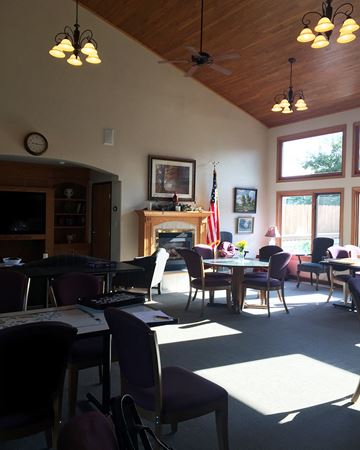 Crookston apartment for rent - a dining room with tables and chairs and a fireplace
