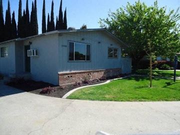 Modesto apartment for rent - A house with a white exterior and a brick wall under the windows.