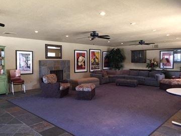 Modesto apartment for rent - a living room with couches and chairs and a fireplace