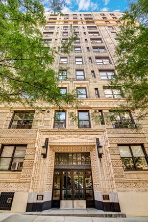 Manhattan apartment for rent - a large brick building with trees in front of it