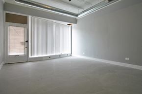Oak Park apartment for rent - an empty living room with white walls and a door