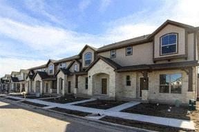 Pflugerville house for rent - a row of houses on the side of a street
