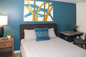 Lancaster apartment for rent - a bedroom with blue walls and a bed with pillows