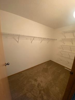 Fargo apartment for rent - Empty room with a door and a shelf.