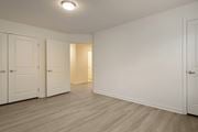 Toms River apartment for rent - a bedroom with two closets and a door to a hallway