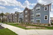 Toms River apartment for rent - an exterior view of an apartment building with a sidewalk