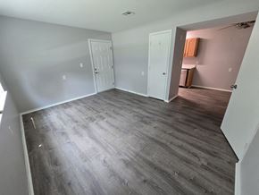 Mechanicsville apartment for rent - A room with grey flooring and white walls.