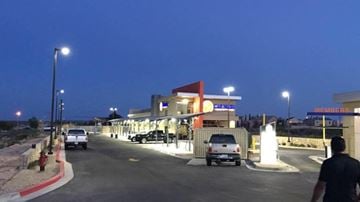 El Paso apartment for rent - a gas station with cars parked in front of it at night