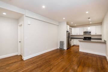 San Francisco apartment for rent - A kitchen with white cabinets and a wooden floor.