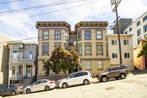 San Francisco apartment for rent - A row of houses with cars parked in front.