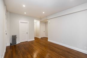 San Francisco apartment for rent - A room with wooden floors and white walls.